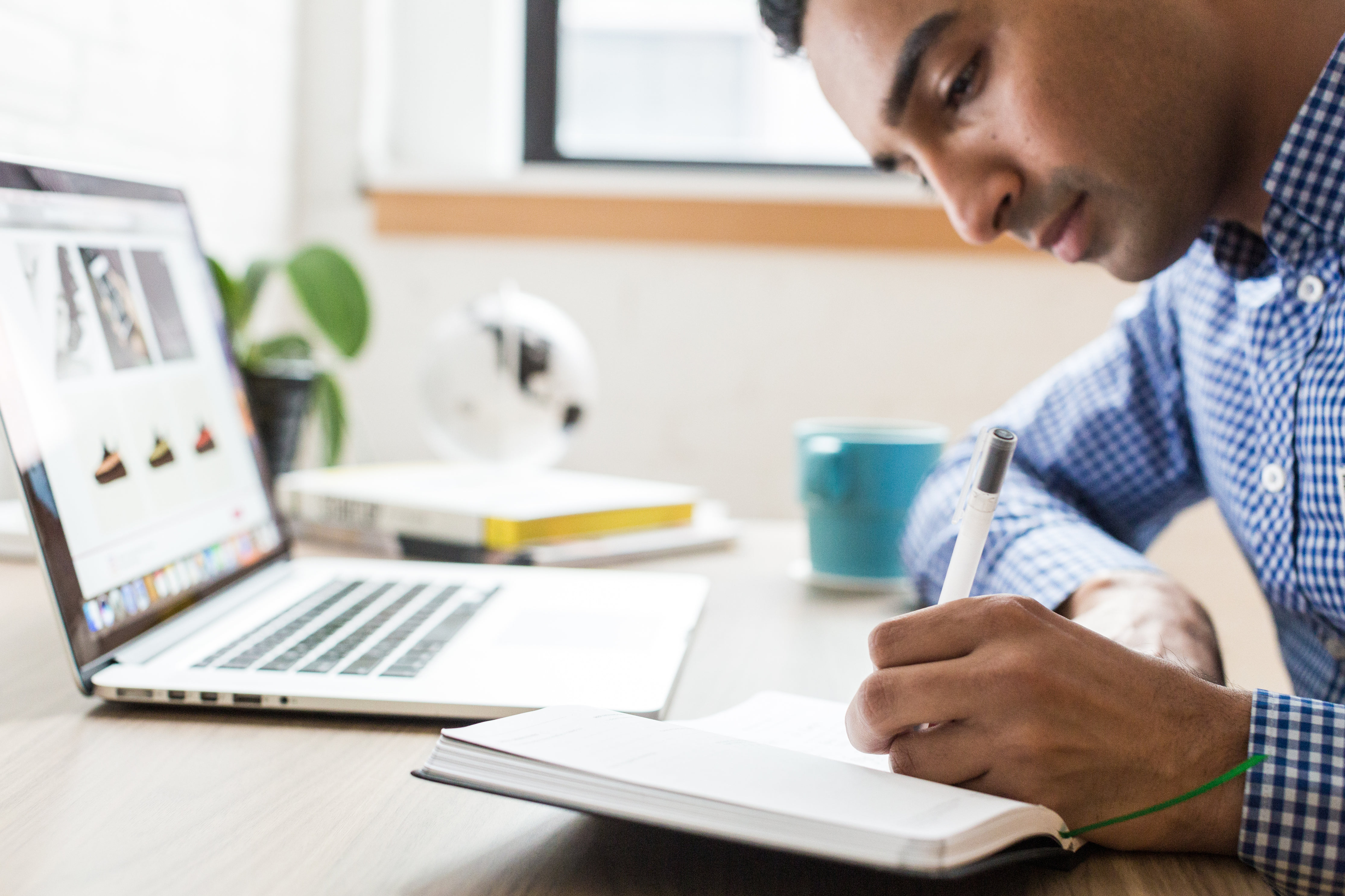 man-writing-in-notebook.jpg